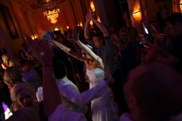 Guests dance to a Mighty Fine DJ at a Danesfield House Wedding
