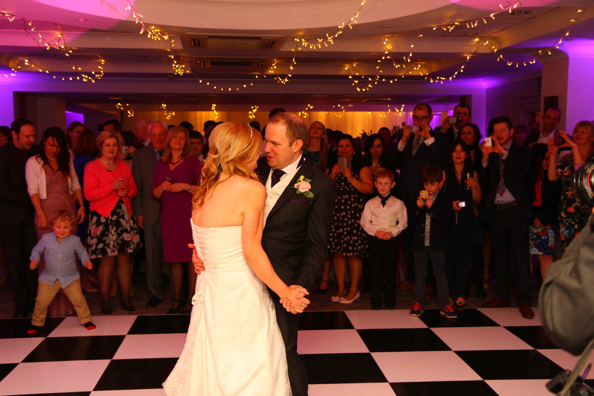 Wedding DJ playing first dance for happy couple at Oakley Court wedding
