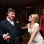 Happy bride and bridegroom dancing the night away to a Mighty Fine Events wedding DJ at Brockett Hall