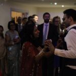 Wedding DJ plays first dance for a very happy couple at Millbridge Court luxury wedding venue in Surrey