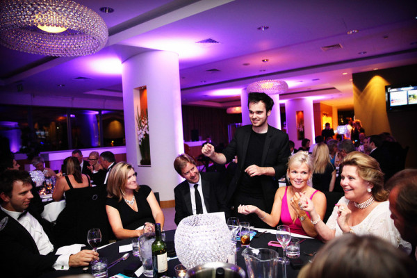 Corporate party guests enjoy Magician