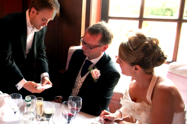 Magician performs card tricks at a Wedding