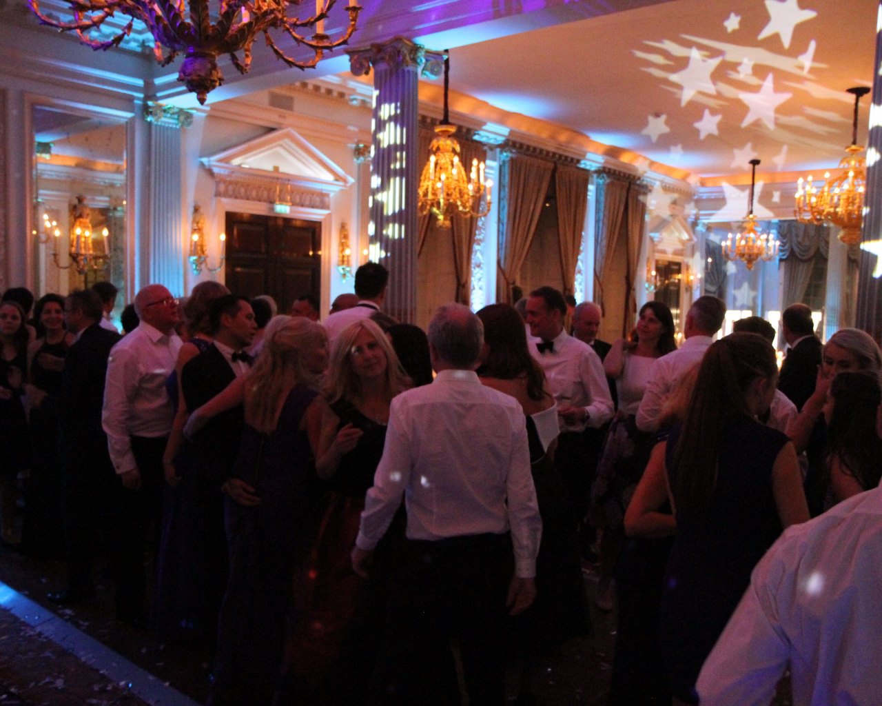 Wedding guests dance to DJ at the RAC club London