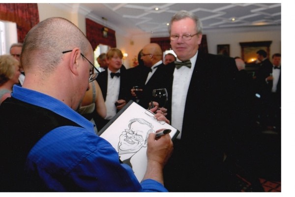 Caricature Artist sketches guests during Corporate Event
