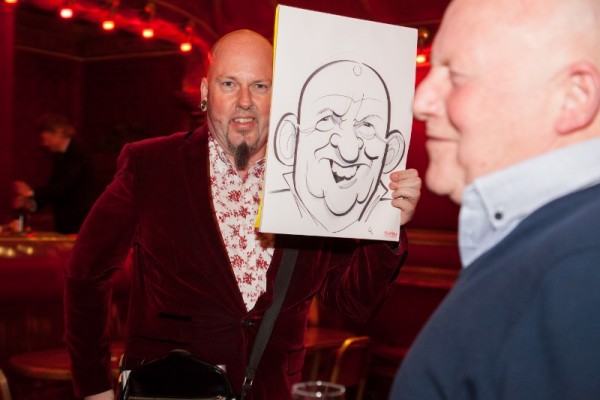 George G Williams draws a caricature at a Corporate Event