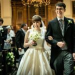Wedding DJ at Stationers' Hall luxury wedding venue in London - Happy bride and groom walk down the aisle