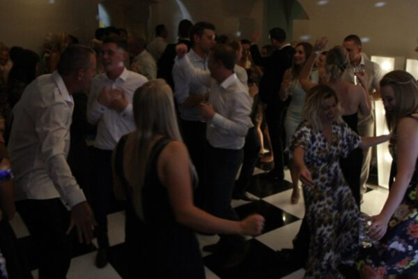 Guests dance to wedding DJ at Queen's House London wedding venue