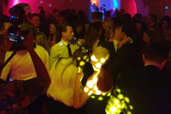 Wedding DJ and party light projections on guests at Queen's House in Greenwich, London