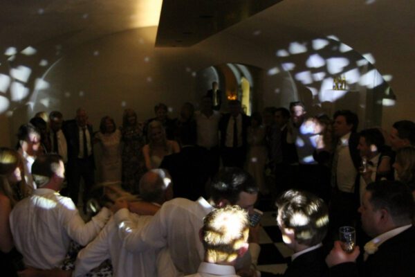 Guests dancing to wedding DJ at Queen's House London wedding venue