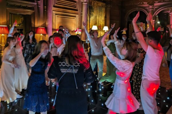 Wedding DJ at Cliveden House luxury UK wedding venue - guests dancing on LED dance floor