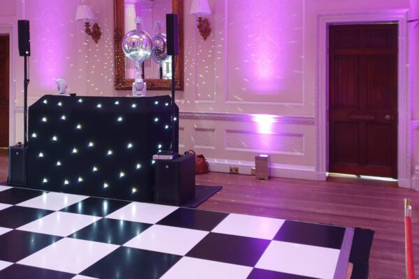 Wedding DJ at Hedsor House luxury wedding venue in Buckinghamshire - black and white check dance floor hire