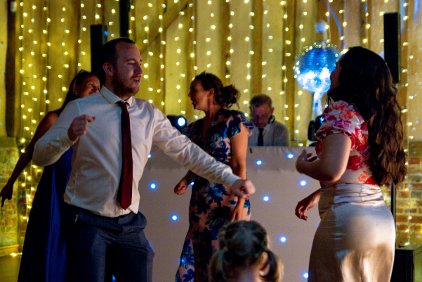 Guests dance to wedding DJ at Berkshire wedding venue Lillibrooke Manor 