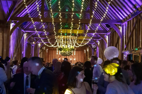 Wedding DJ and ceiling fairy lighting at Lillibrooke Manor barn wedding venue in Berkshire