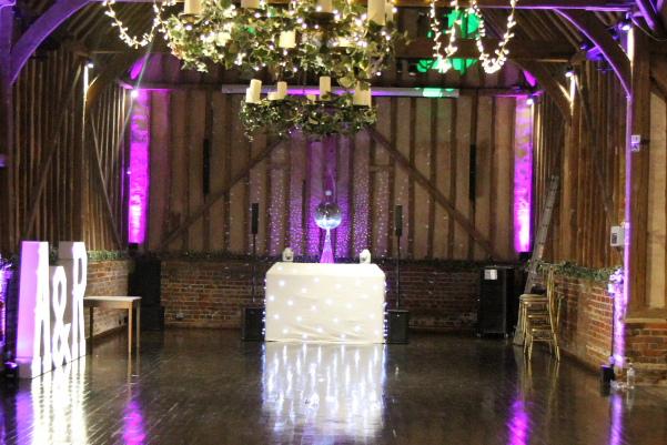 Wedding DJ booth setup and fairy lighting at Lillibrooke Manor barn wedding venue in Berkshire
