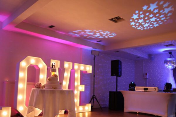 Wedding DJ at Stoke Place wedding venue in Buckinghamshire - LOVE light up letters and DJ setup