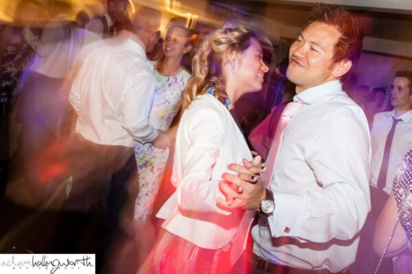 Wedding DJ at Stoke Place wedding venue in Buckinghamshire - guests mingling and dancing