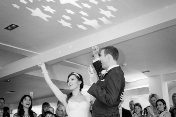Wedding DJ playing first dance for happy couple at Stoke Place wedding venue in Buckinghamshire