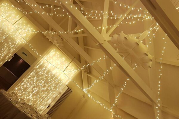 Wedding DJ at Stoke Place wedding venue in Buckinghamshire - ceiling fairy lights in barn