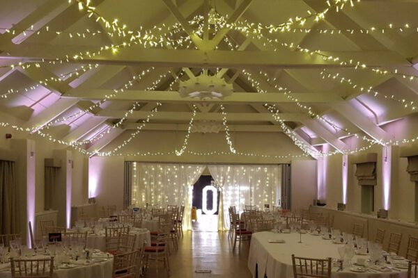 Wedding DJ at Stoke Place wedding venue in Buckinghamshire - barn fairy lighting, seating and light up letters 