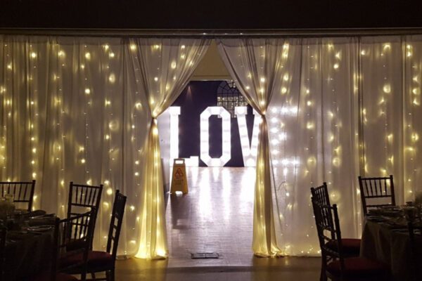 Wedding DJ at Stoke Place wedding venue in Buckinghamshire - fairy lights and LED light up letters