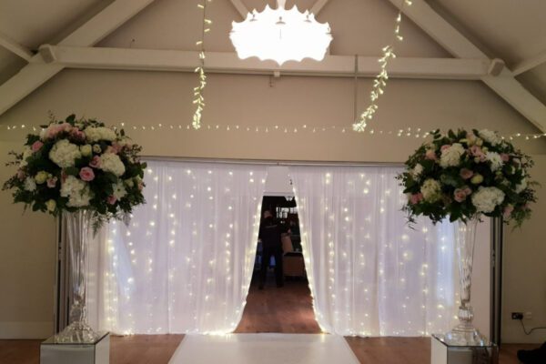 Wedding DJ at Stoke Place wedding venue in Buckinghamshire - fairy light curtains