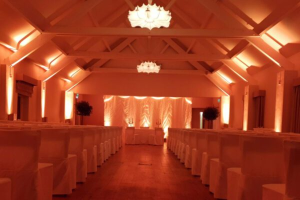 Wedding DJ at Stoke Place wedding venue in Buckinghamshire - orange mood lighting