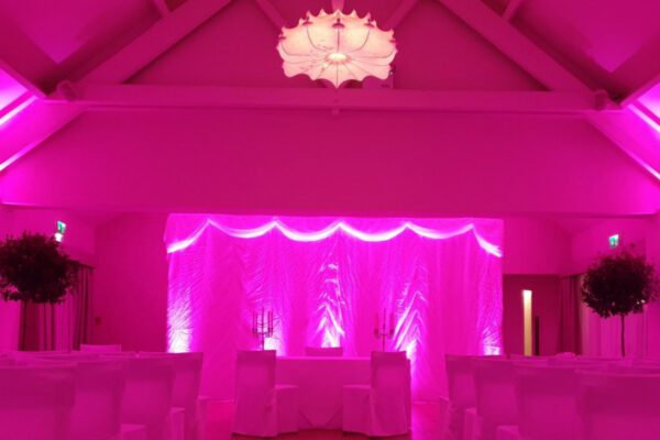Wedding DJ at Stoke Place wedding venue in Buckinghamshire - pink lighting ideas