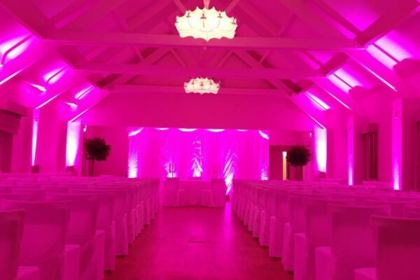 Wedding DJ at Stoke Place wedding venue in Buckinghamshire - pink mood lighting