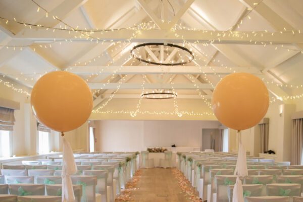Wedding DJ at Stoke Place wedding venue in Buckinghamshire - neutral elegant decor setup in barn