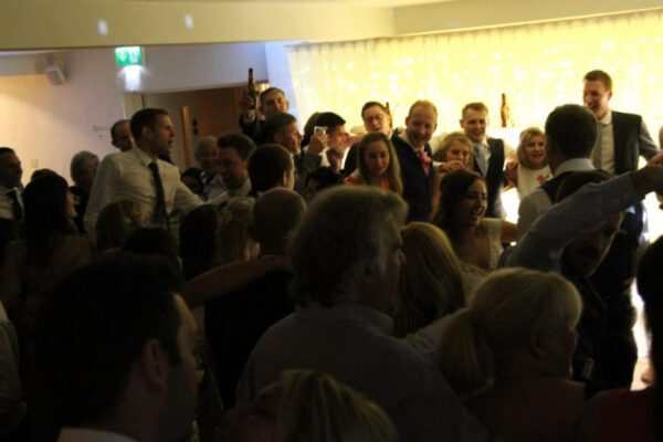 Wedding DJ playing to guests at Stoke Place luxury wedding venue in Buckinghamshire