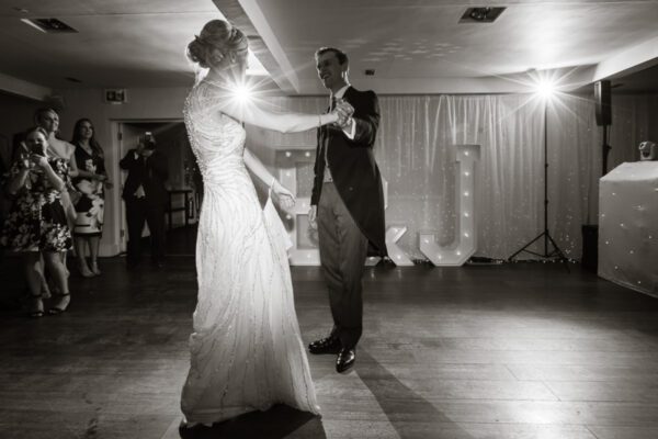 Wedding DJ at Stoke Place wedding venue in Buckinghamshire - bride and groom enjoying their first dance