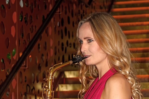 Heather sax player to book with DJ in red dress