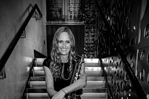 Heather sax player to book with DJ on stairs