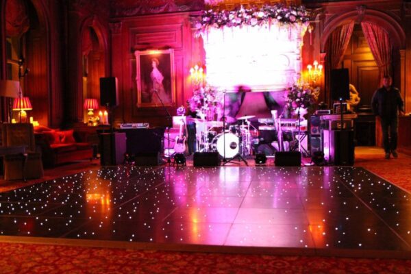 Wedding DJ and event production at Cliveden House, Berkshire - band setup and black LED dance floor