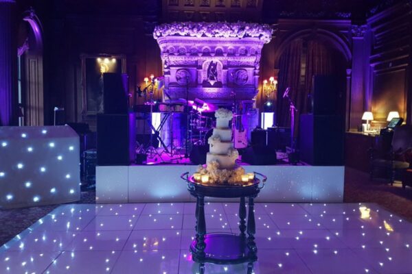 Wedding DJ and event production at Cliveden House, Berkshire - DJ booth, live band setup and white LED dance floor