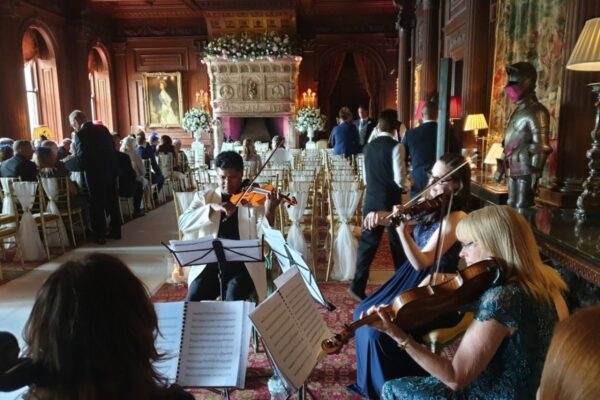 Wedding DJ and classical entertainment at Cliveden House, Berkshire - violinists playing for guests at ceremony
