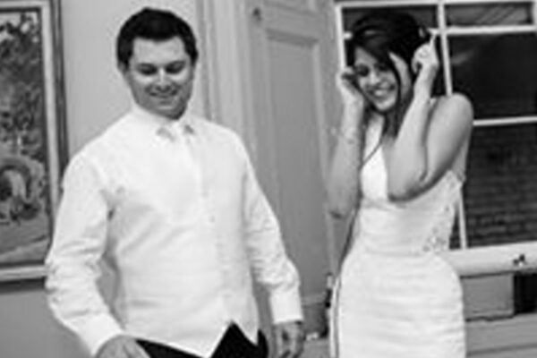 Wedding DJ at Cliveden House, Berkshire - bride and groom on the DJ decks