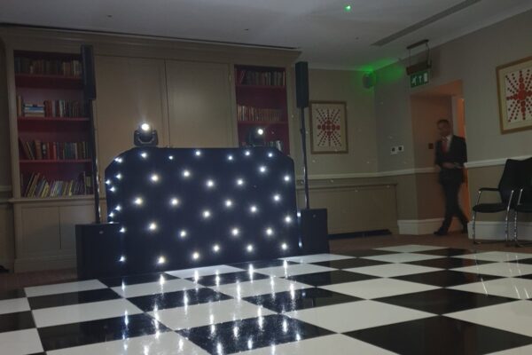 Wedding DJ at Cliveden House, Berkshire - black DJ booth setup with white and black check dance floor