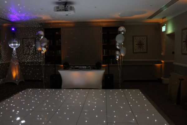 Wedding DJ at Cliveden House, Berkshire - DJ booth options with white dance floor and mirror ball
