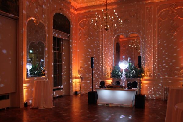 Wedding DJ for London venue 10-11 Carlton House Terrace - DJ booth with mirror ball and orange mood lighting