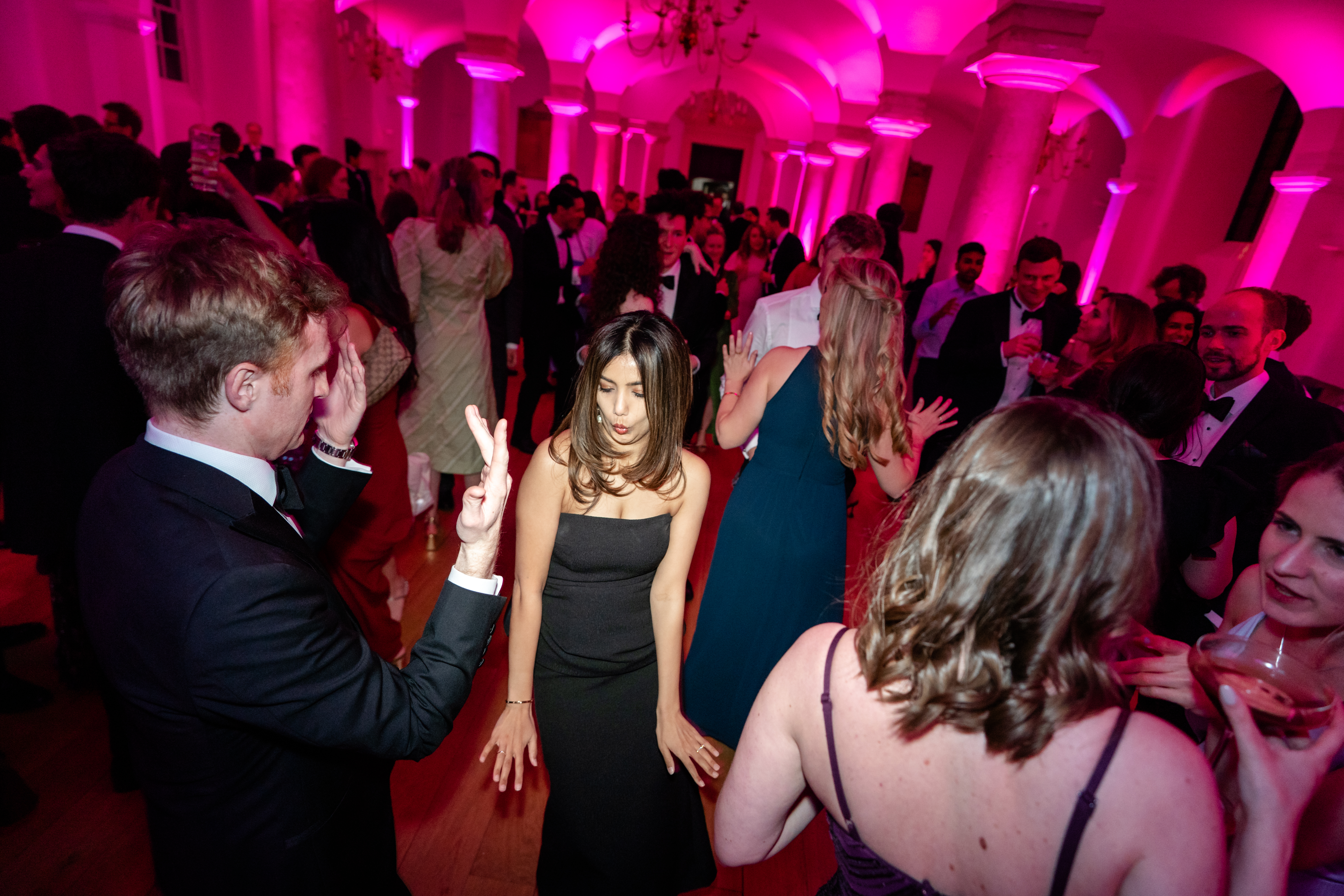 Christmas party guests having a dance