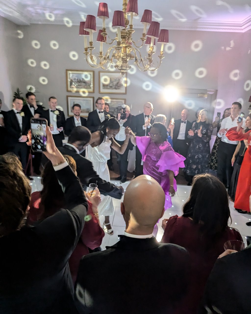 Guests dancing at a wedding at Cliveden House in Berkshire, UK.