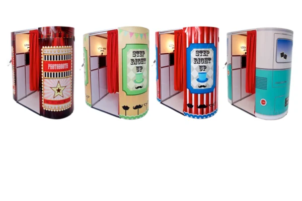 Four colourful photo booths with red curtains are lined up side by side, each unique booth decorated with playful designs and signage inviting people to step inside for fun photo booth memories.